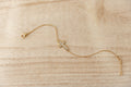 Held Cross Bracelet